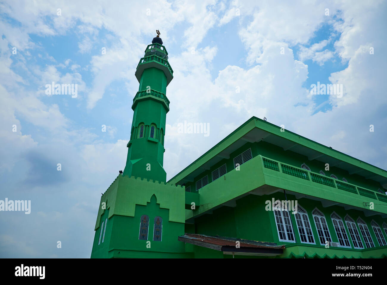 Graphic look at a bright green mosque in Medan, Indonesia. Stock Photo
