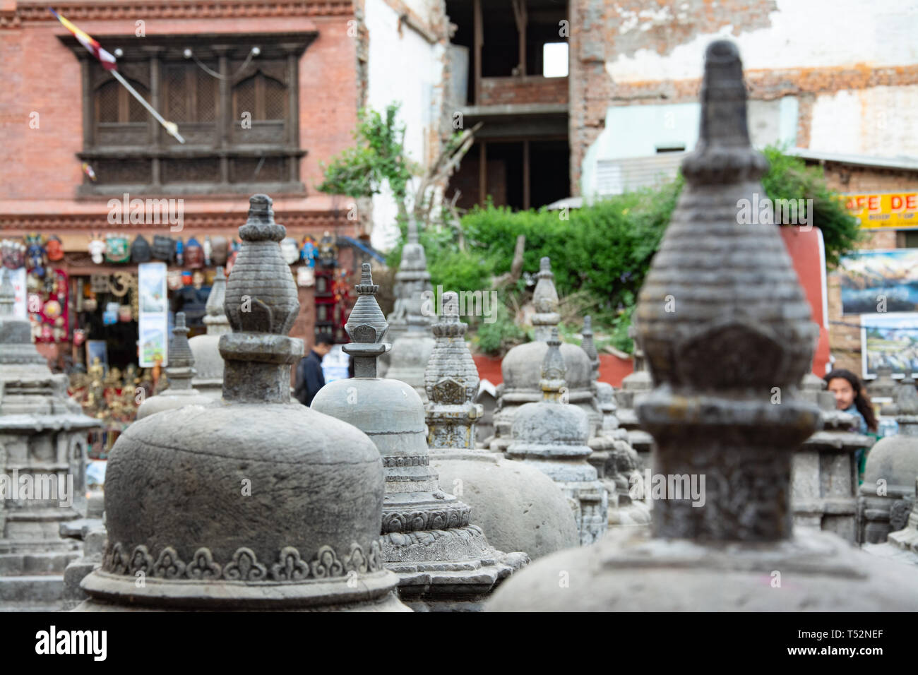 Kathmandu, Nepal - May 13, 2017: Stupas dedicated to Lord Buddha in the courtyard of Swoyambhunath. Stock Photo