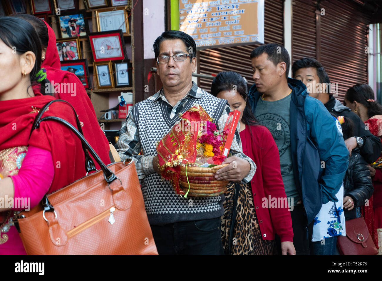 Gorkha, Nepal - November 04, 2017: Monk tying holy thread to devotees in  the premises of Manokamana devi temple Stock Photo - Alamy