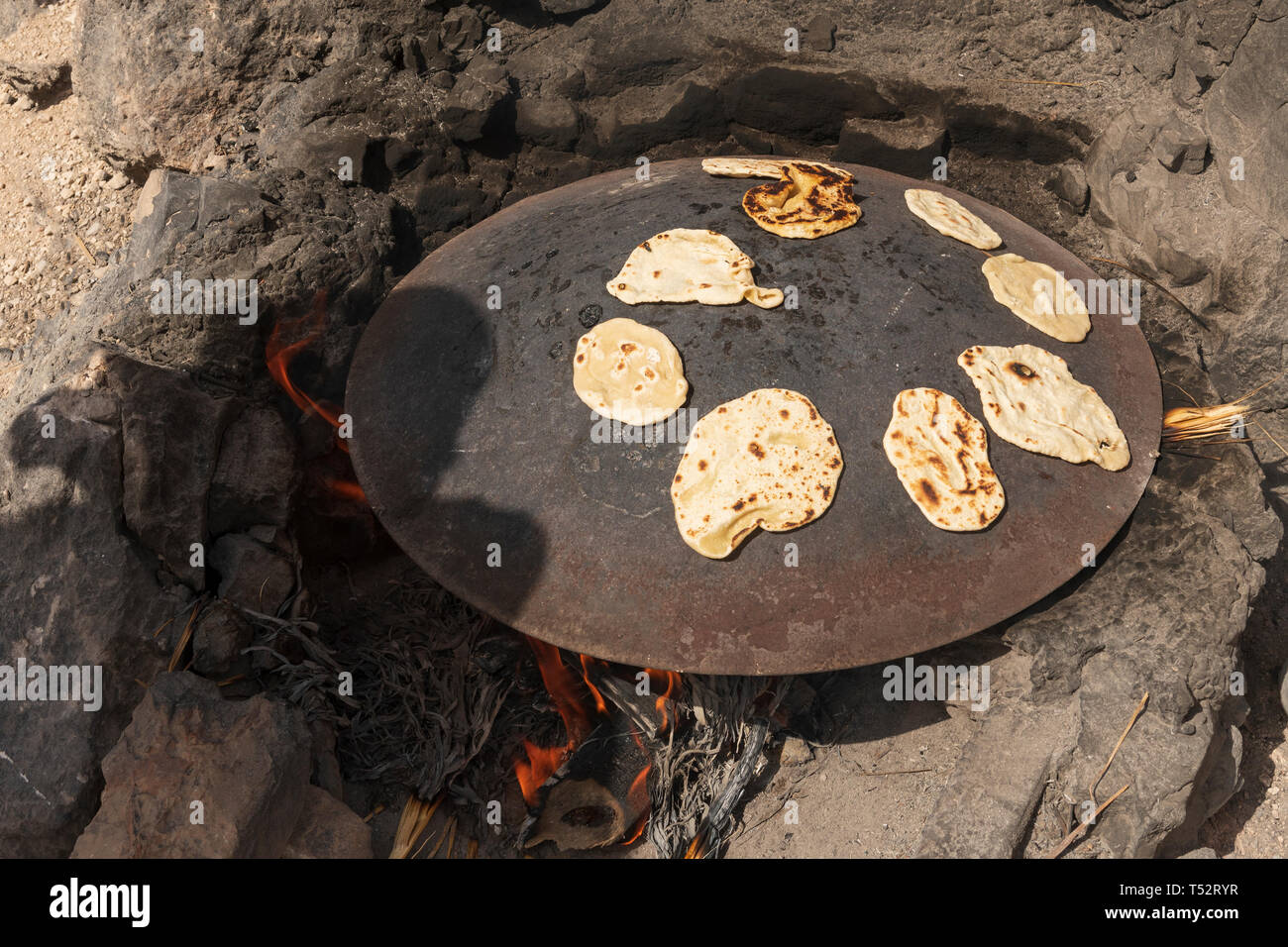 Pita Bread Cooking over a Fire in the Judean Desert in Israel Stock