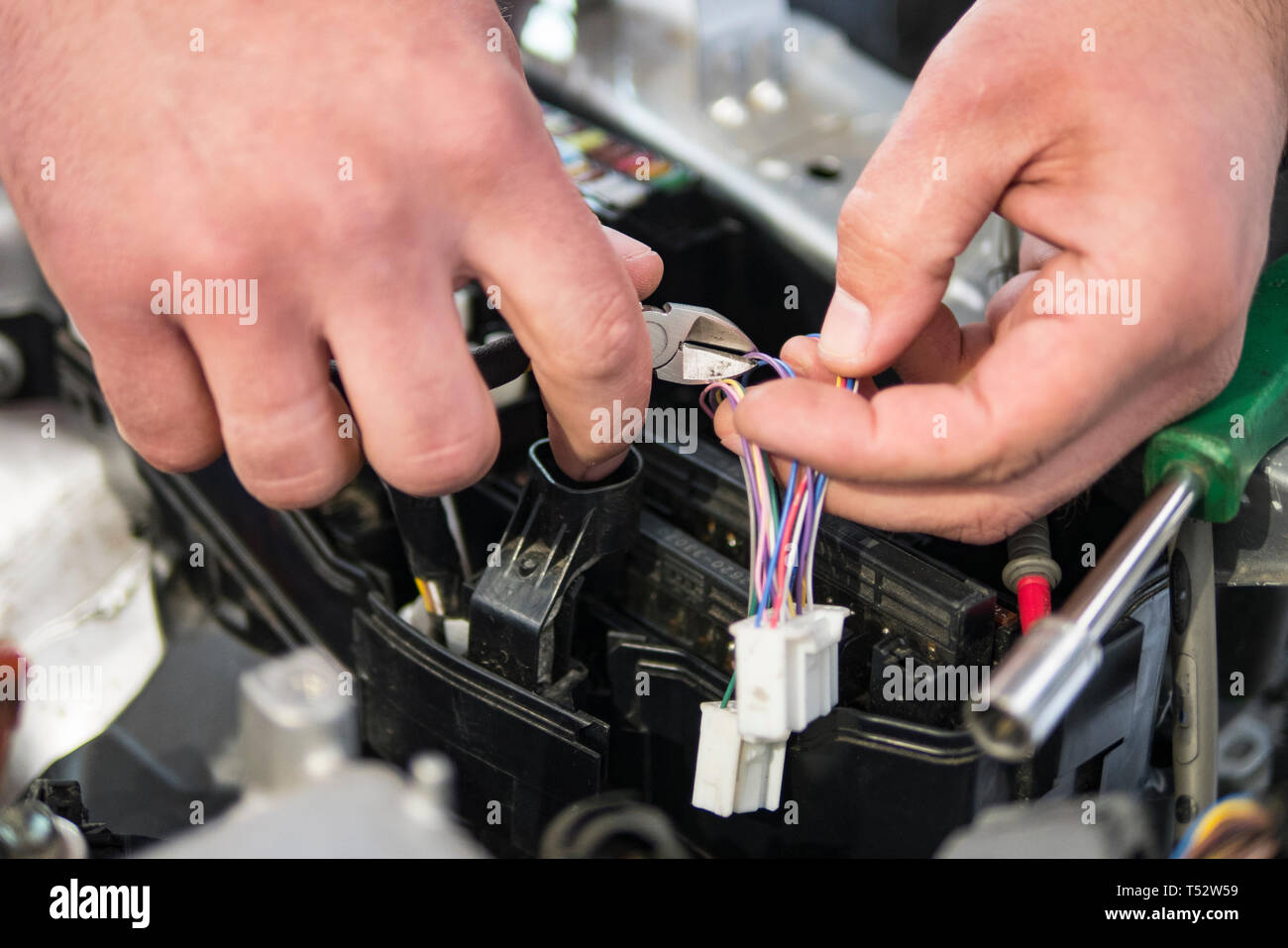 car electrician repairs car, tester and fuses and nippers Stock Photo