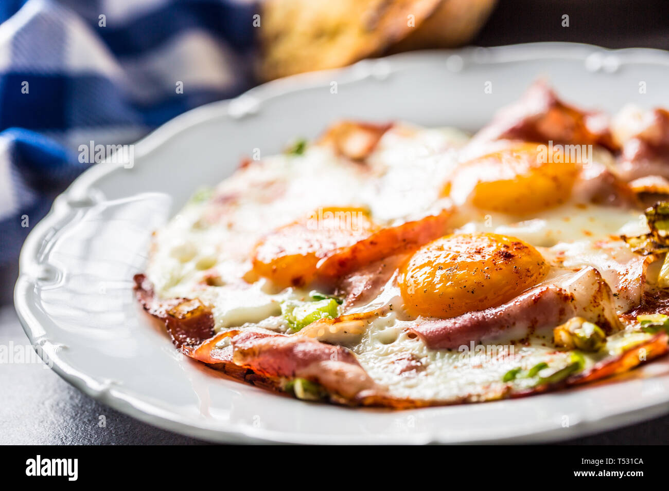 English breakfast fried bacon ham and eggson white plate Stock Photo