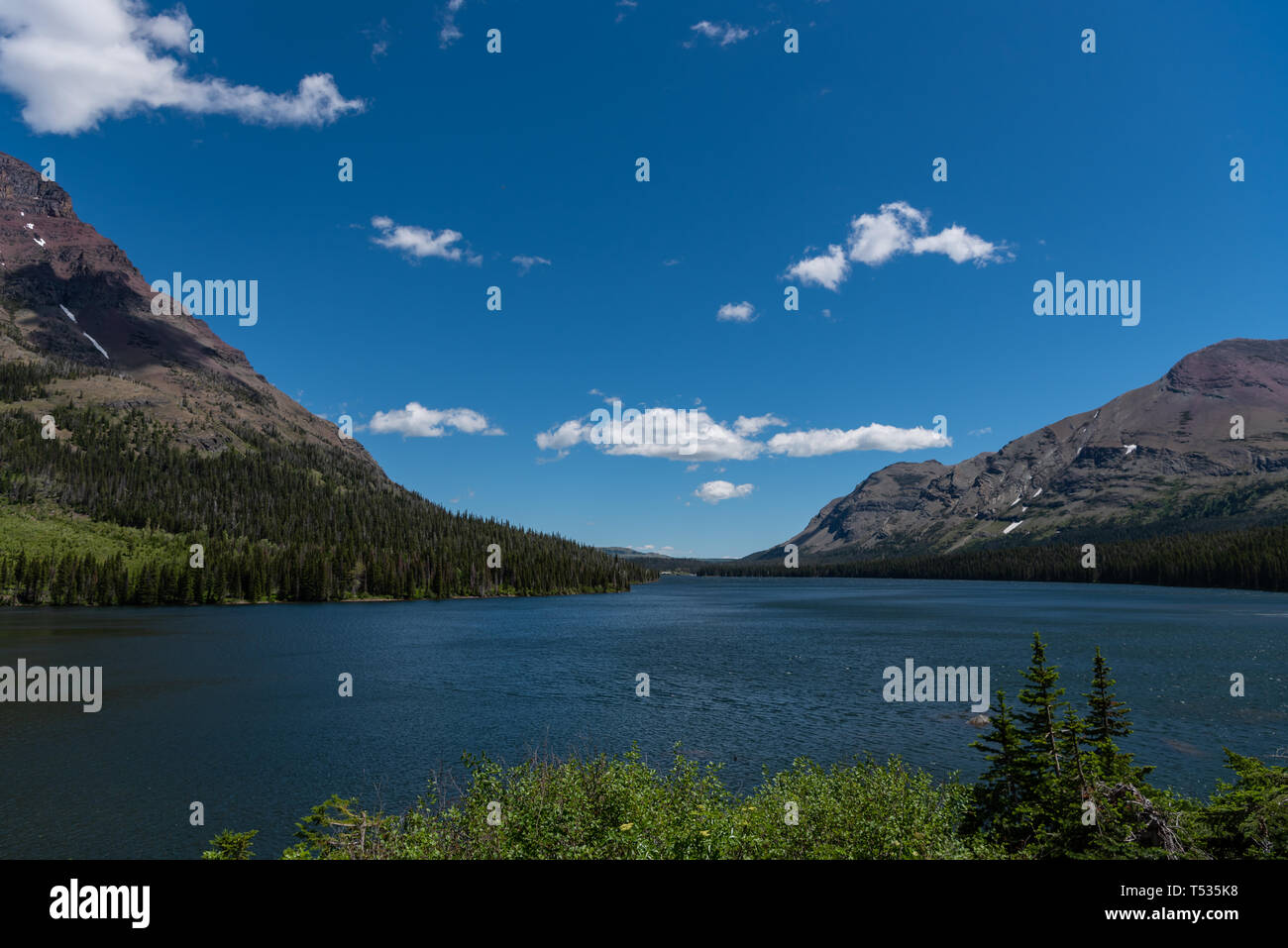 Two Medicine Lake Stretches Out into Montana Mountains Stock Photo Alamy