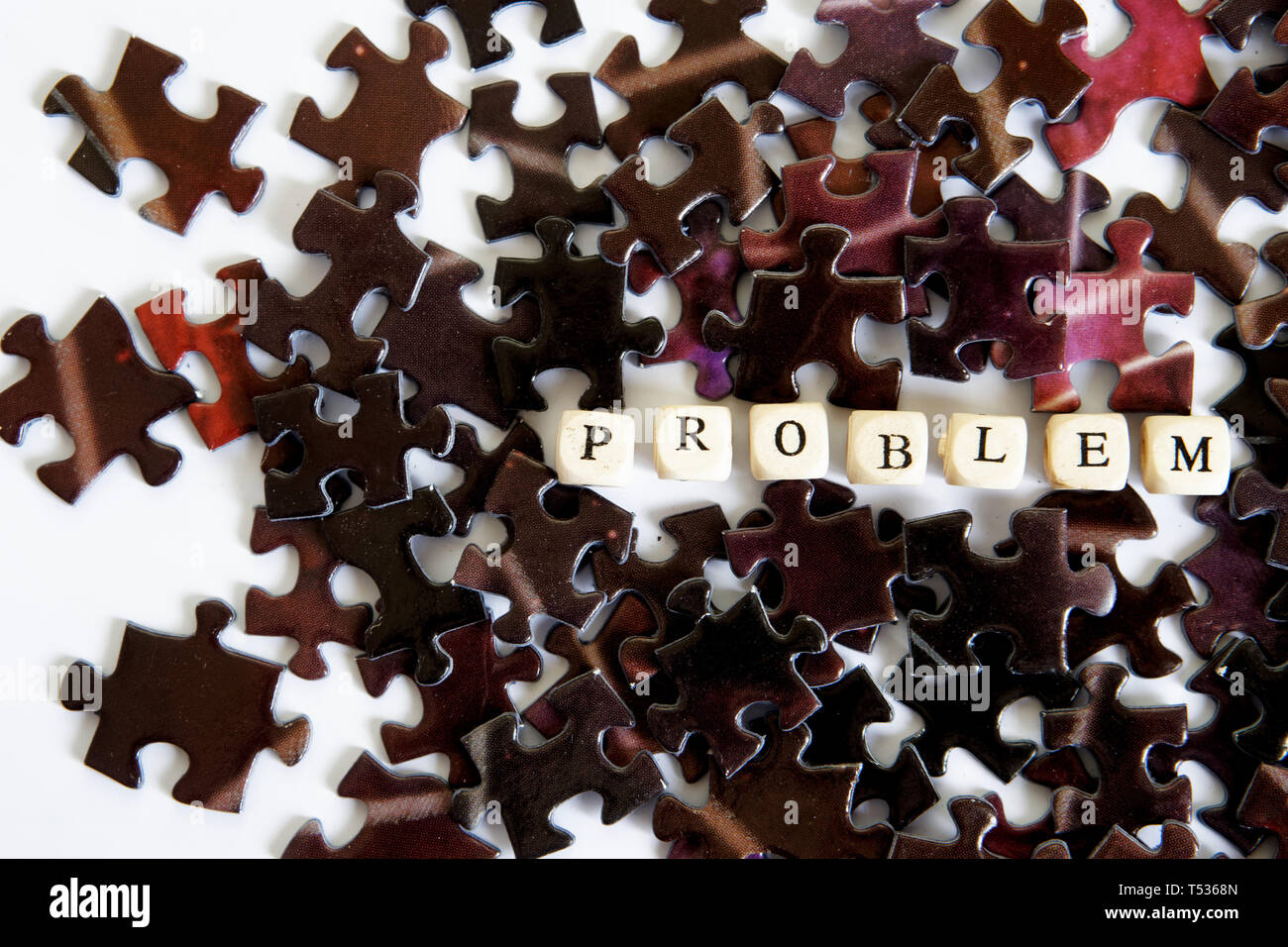 Solving complex problems. Assembling puzzles. Opportunities out of the problem situation. White background. Stock Photo
