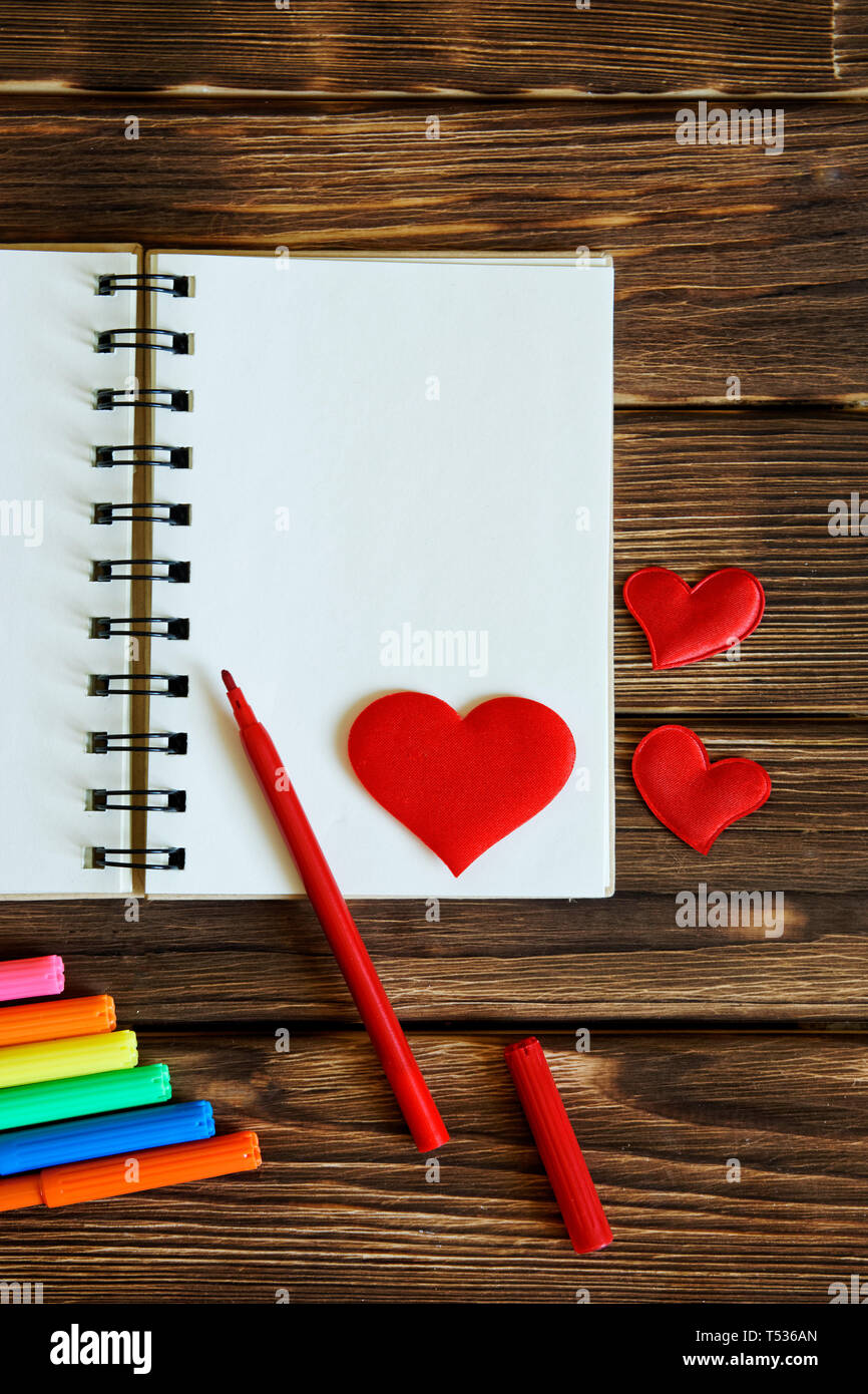 Blank Notepad With Felt Tip Pens And Red Hearts On Wooden Background Preparation For Congratulations On Valentine S Day Template Vertical Image Stock Photo Alamy