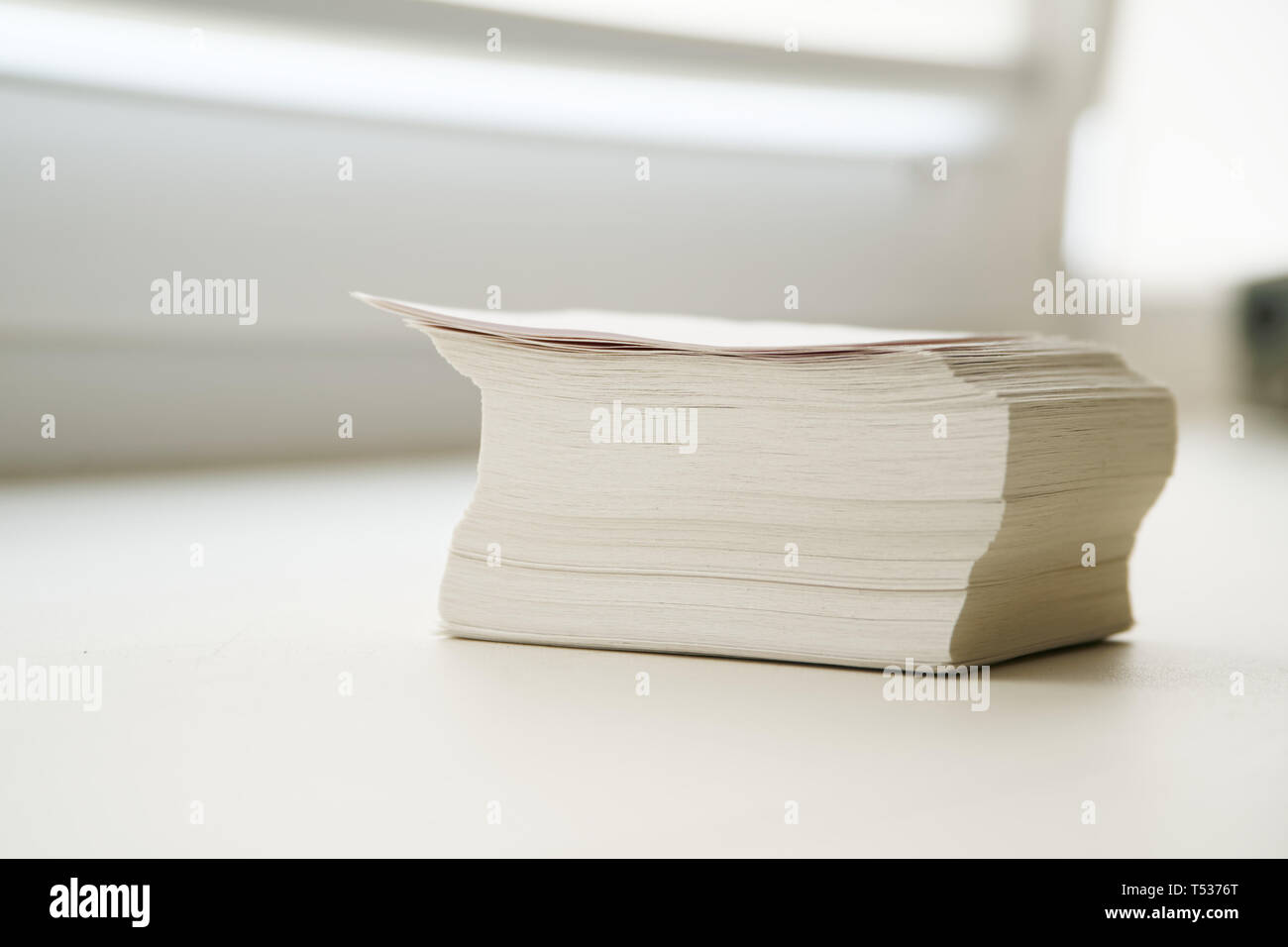 A stack of notes is on the windowsill in the office. Close-up Stock Photo