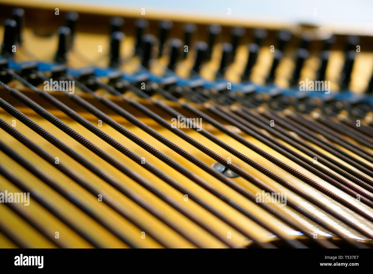 Bass strings strung in the old piano. The mechanism of musical ...