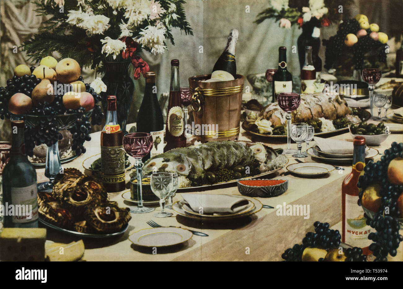 Dinner table served for typical Soviet family full of tasty meals and alcoholic drinks depicted in the colour illustration in the Book of Tasty and Healthy Food published in the Soviet Union (1953). Stock Photo