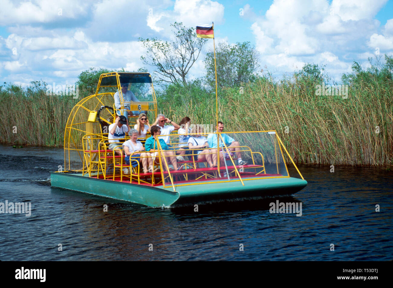 Florida Everglades Miccosukee Seminole Indian Reservation,airboat tour ride riders Tamiami Trail US highway Route 41,visitors sightseeing, Stock Photo