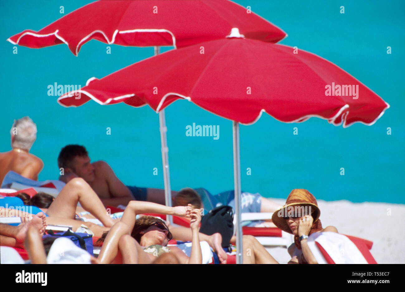 Miami Beach Florida,Atlantic Ocean red rental beach,sand,surf,umbrellas