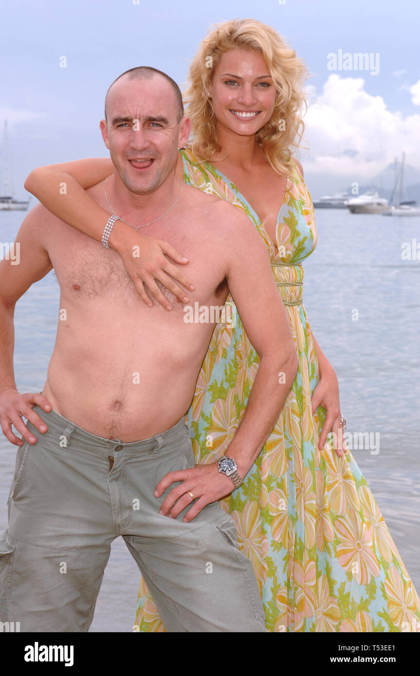 CANNES, FRANCE. May 16, 2005: Australian model/actress KRISTY HINZE & actor JIMOEIN at the 58th Annual Film Festival de Cannes to promote their movie The Extra. © 2005 Paul Smith / Featureflash Stock Photo