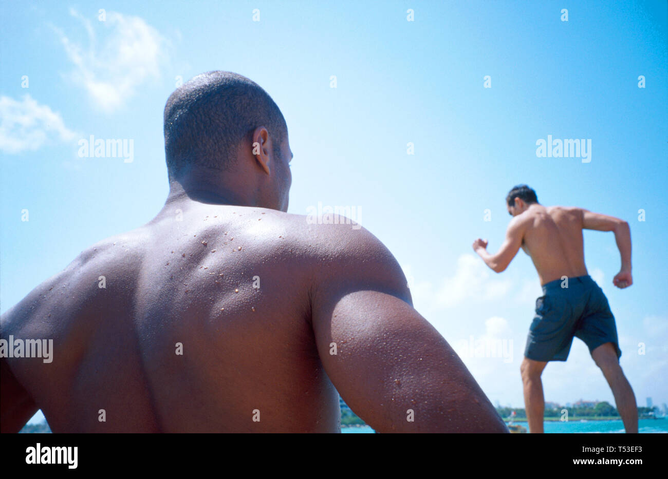 Miami Beach Florida,Atlantic Shore South Pointe Park,Point,public land,recreation,muscular man,male models during photo shoot,visitors travel travelin Stock Photo