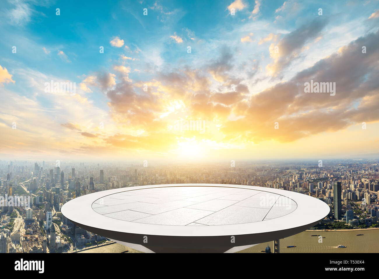 Shanghai city skyline and empty square platform with beautiful clouds at sunset,high angle view Stock Photo