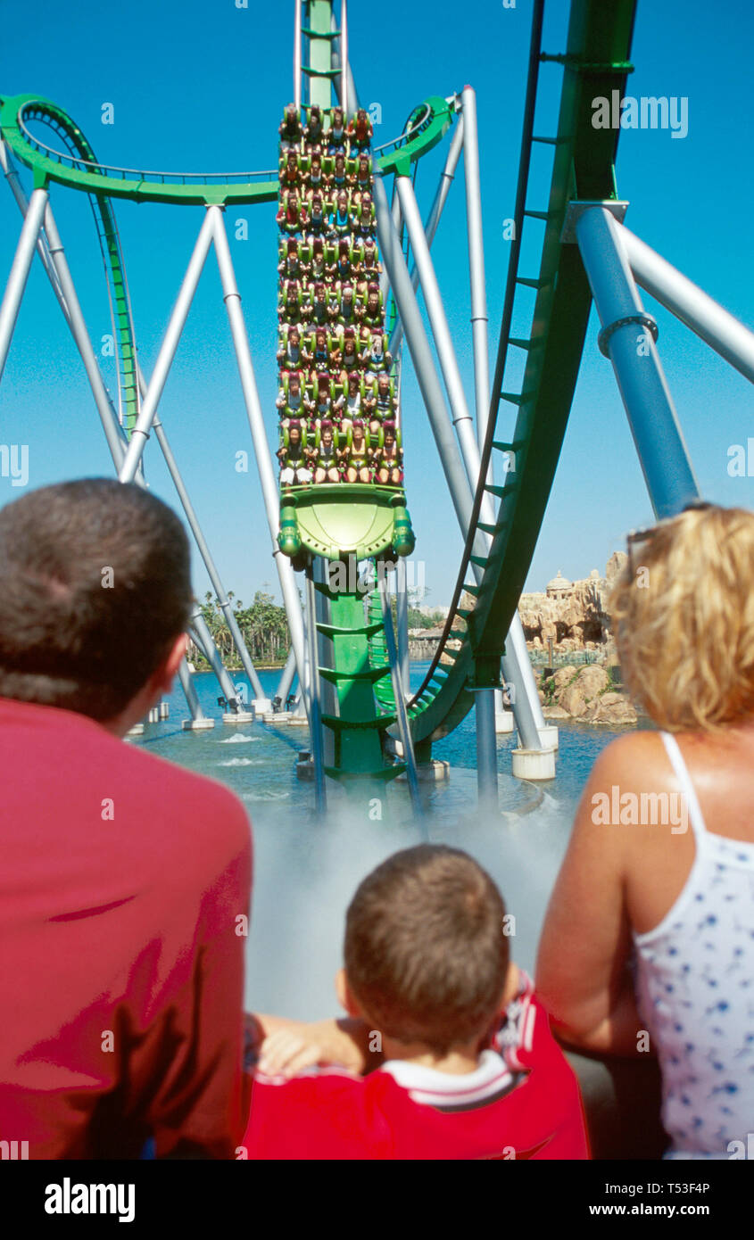 Orlando Florida,Universal Studios,theme park,Incredible Hulk Coaster plunging into foggy tunnel,family families parent parents child chi Stock Photo