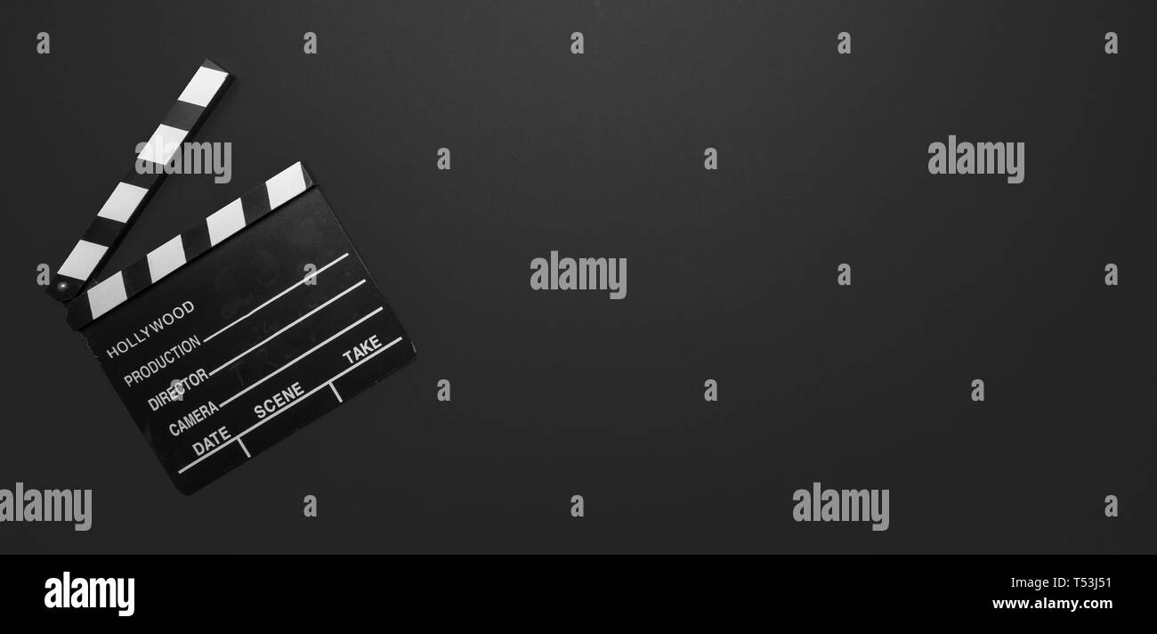 Clapper Banner Cinama film concept. Movie clapper board on black color background ...