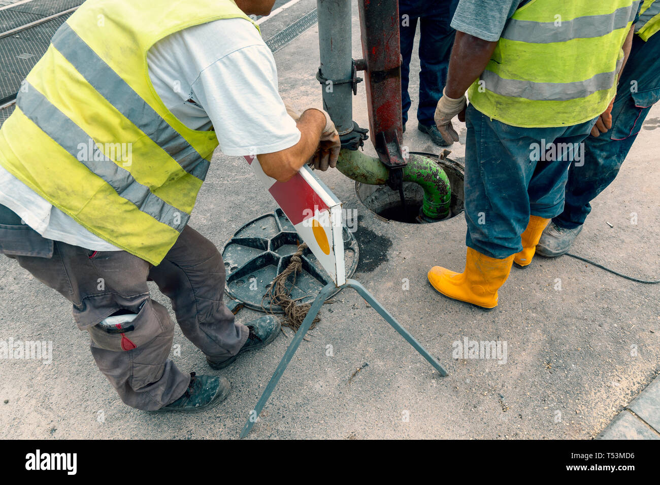 Unblock a drain. Sewer Lines Cleaning Service. Cleaning blocked sewer. Color effect Stock Photo