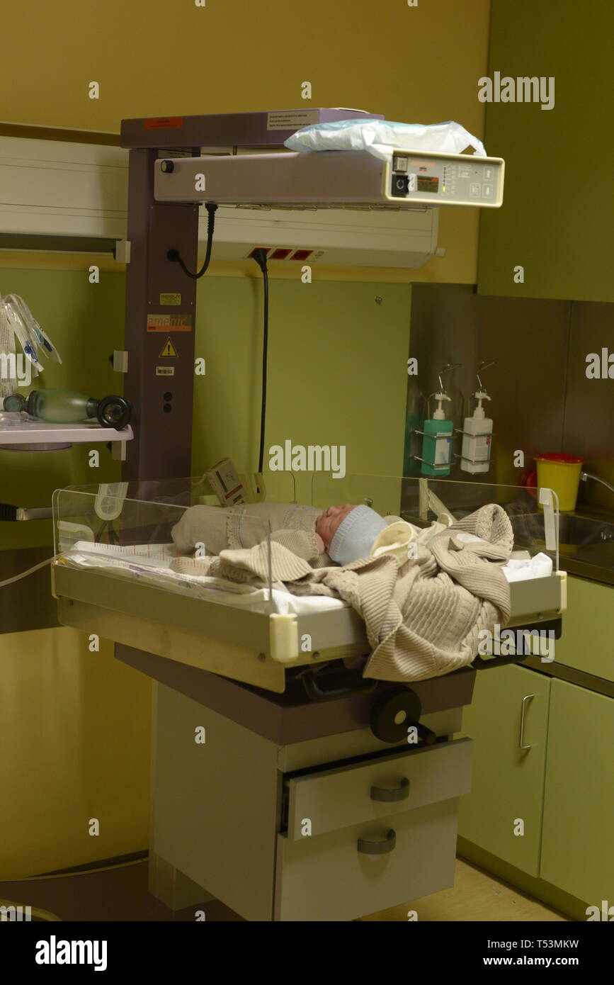 Hospital cot with a newborn baby Stock Photo Alamy