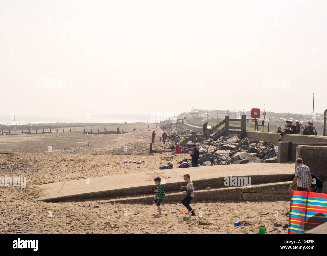 Hornsea, Yorkshire, UK. April 20 2019. Families have fun on the beach on a hot bank holiday. Stock Photo