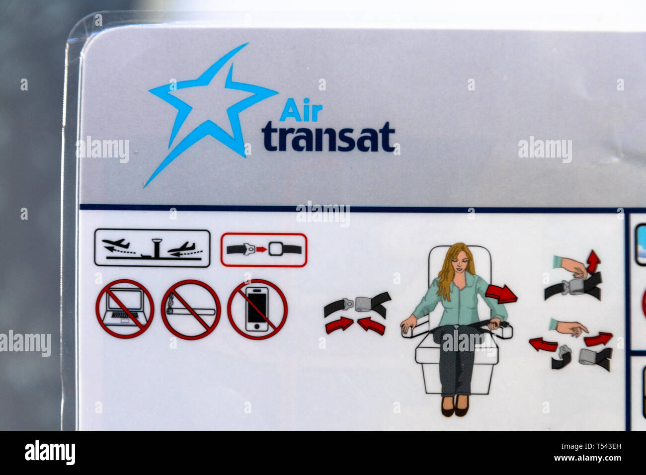 Air Transat safety card found on a Boeing 737-700. It is law in Canada for the crew to go over the instruction card with the passengers before take of Stock Photo