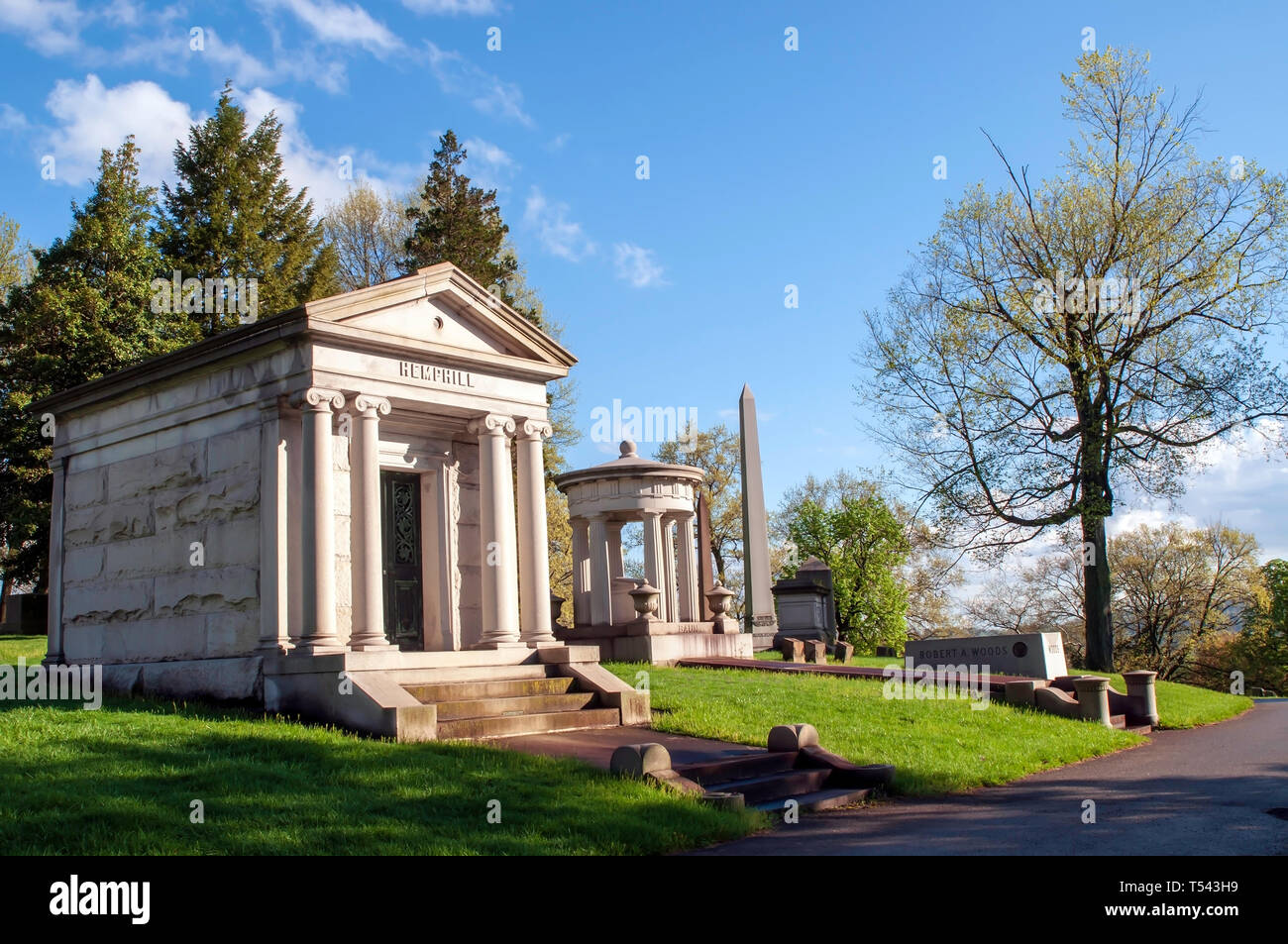 The Hemphill and Baum family mausoleums next to a road in the Homewood Cemetery in Pittsburgh, Pennsylvania, USA Stock Photo