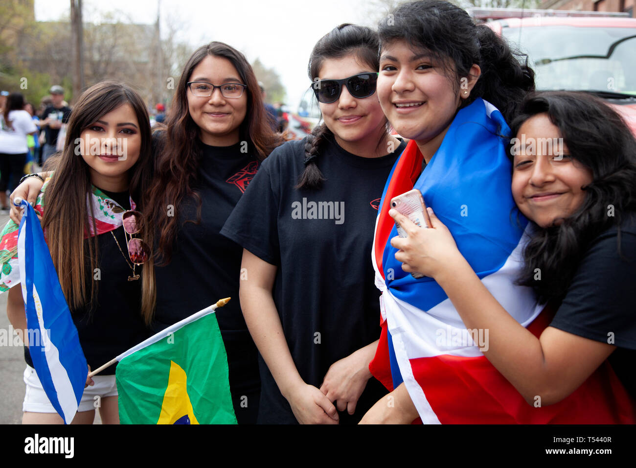 Group of five teenage Hispanic girls smiling at the Cinco de Mayo Parade. St Paul Minnesota MN USA Stock Photo