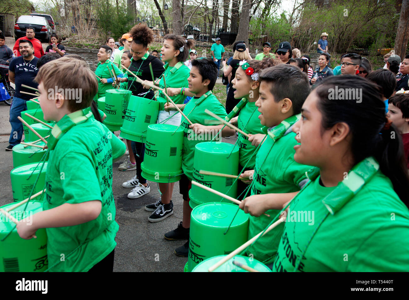Students from Wellstone School in the Drumline with Menards green pails at the Cinco de Mayo Parade. St Paul Minnesota MN USA Stock Photo