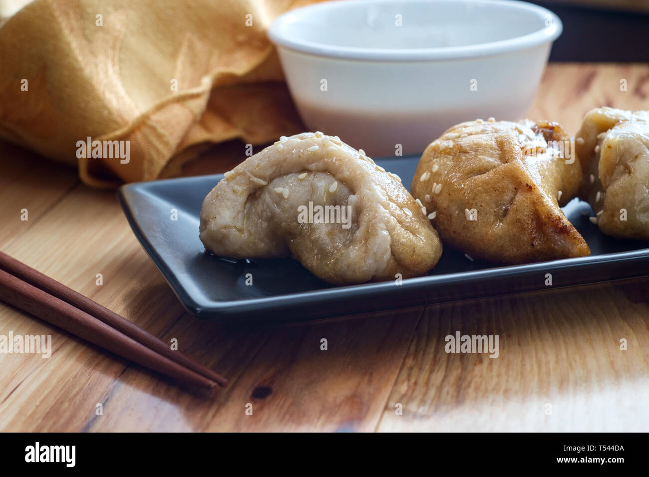 Delicious Chinese Dim Sum dumplings topped with sesame seeds Stock