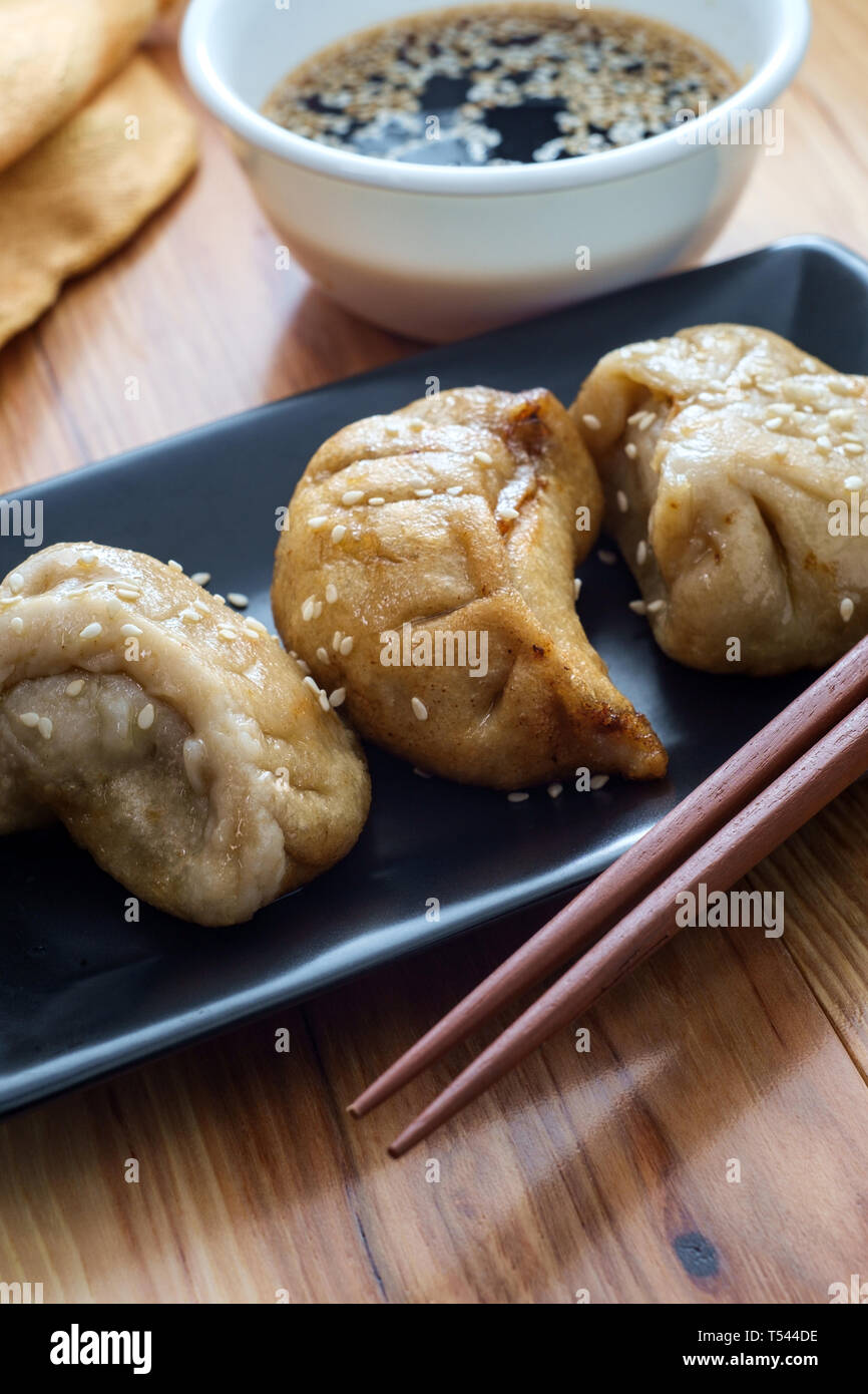 Delicious Chinese Dim Sum dumplings topped with sesame seeds Stock