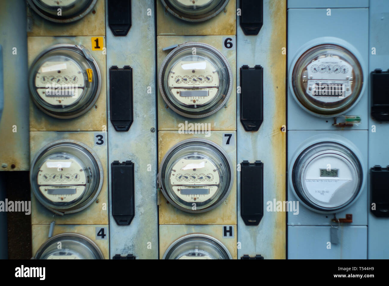 Electric meters measuring usage outside apartment building Stock Photo Alamy