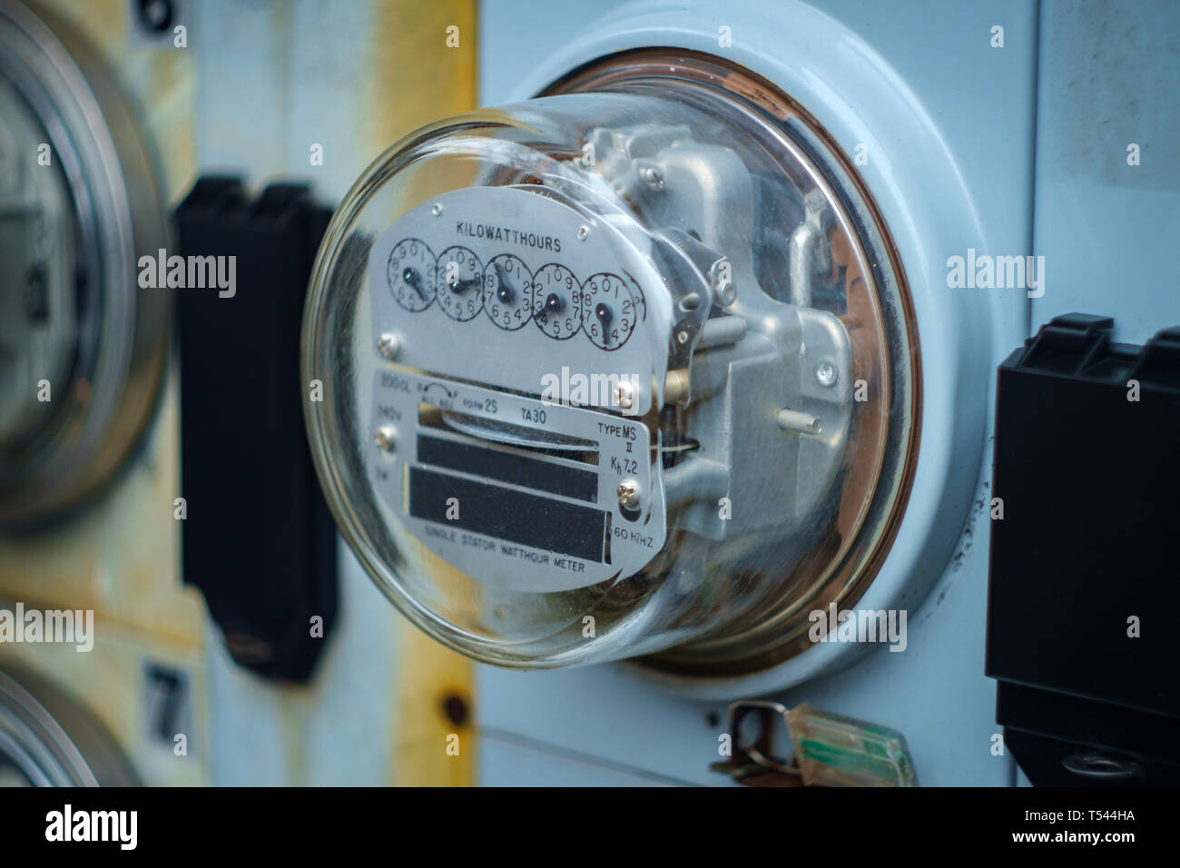 Electric meters measuring usage outside apartment building Stock Photo Alamy