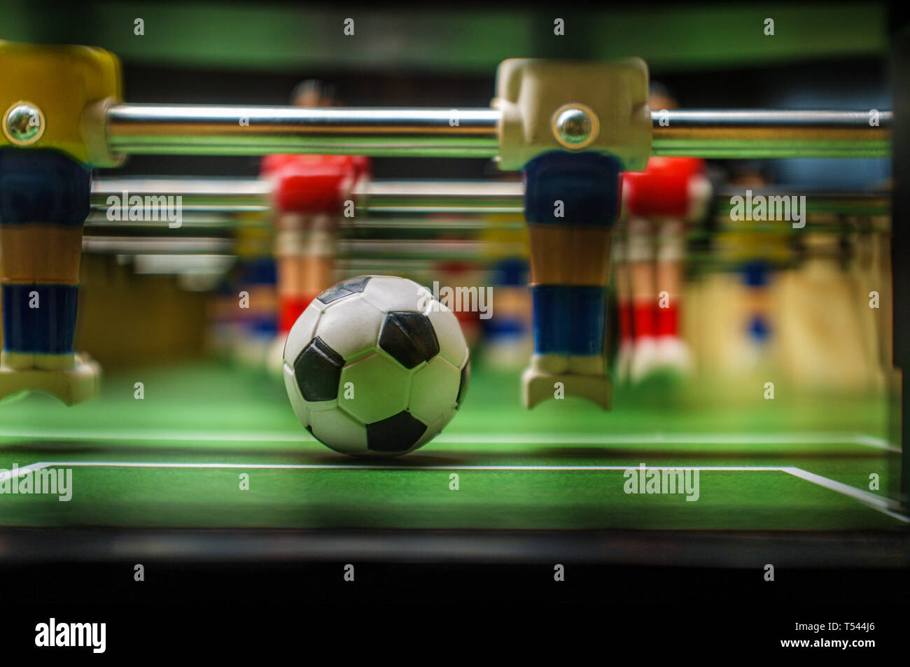 Closeup macro tabletop game of foosball or table football with soccer