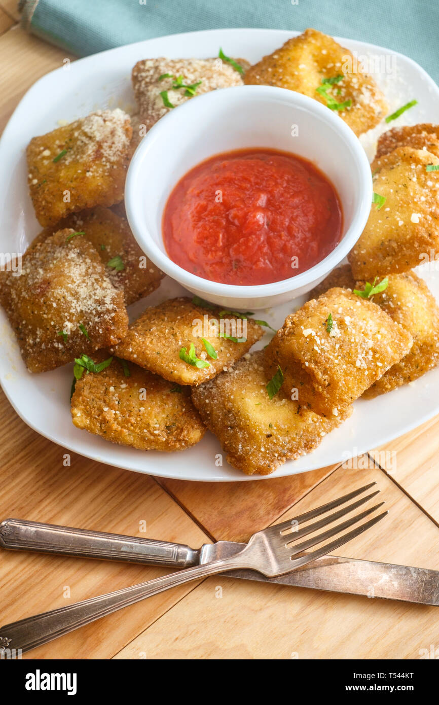 Breaded fried Italian ravioli with hot marinara tomato dipping sauce