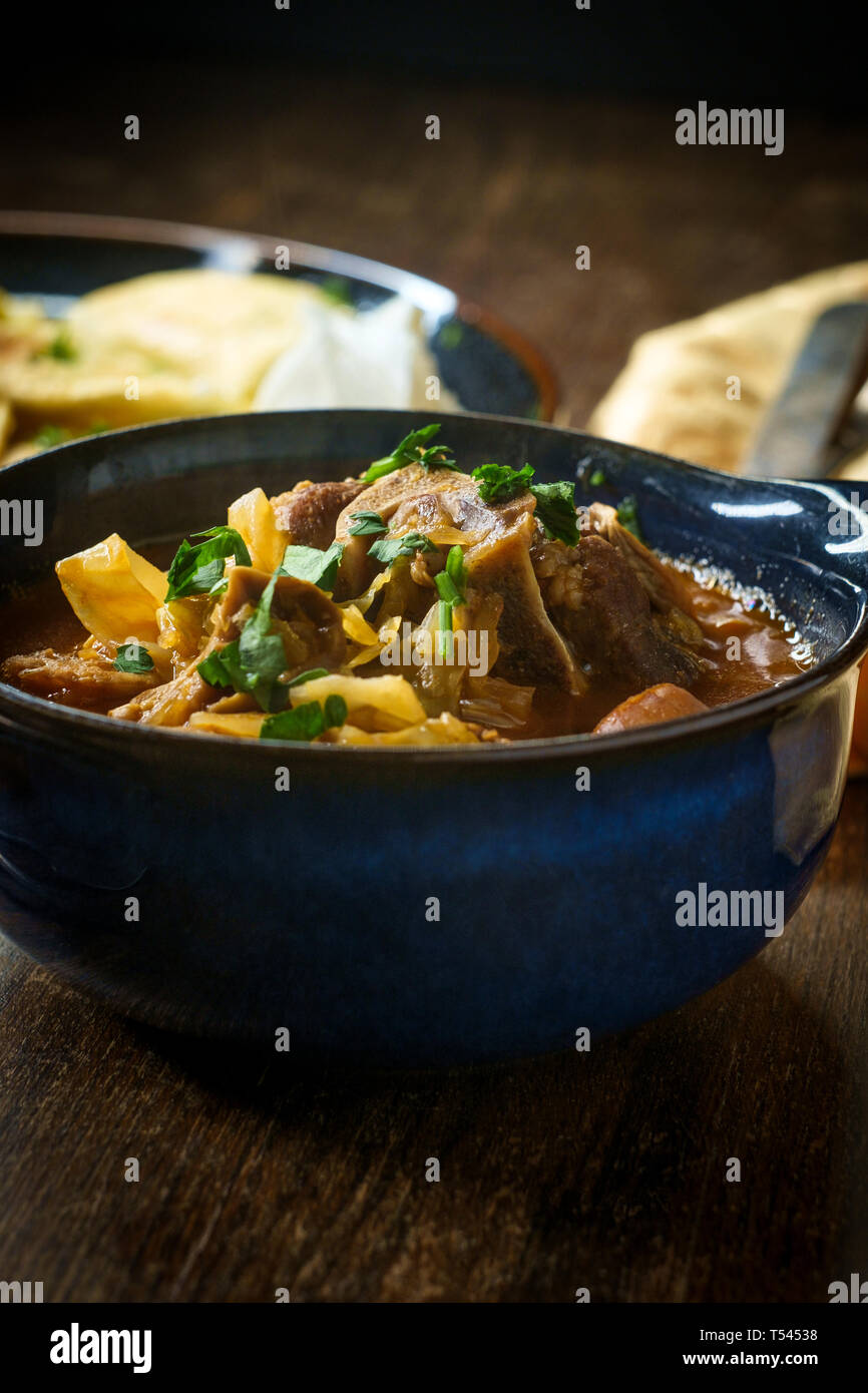 Polish hunters stew known as Bigos with pork loin sausage and lamb neck