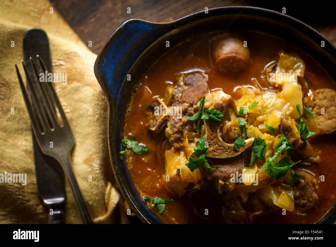 Polish hunters stew known as Bigos with pork loin sausage and lamb neck