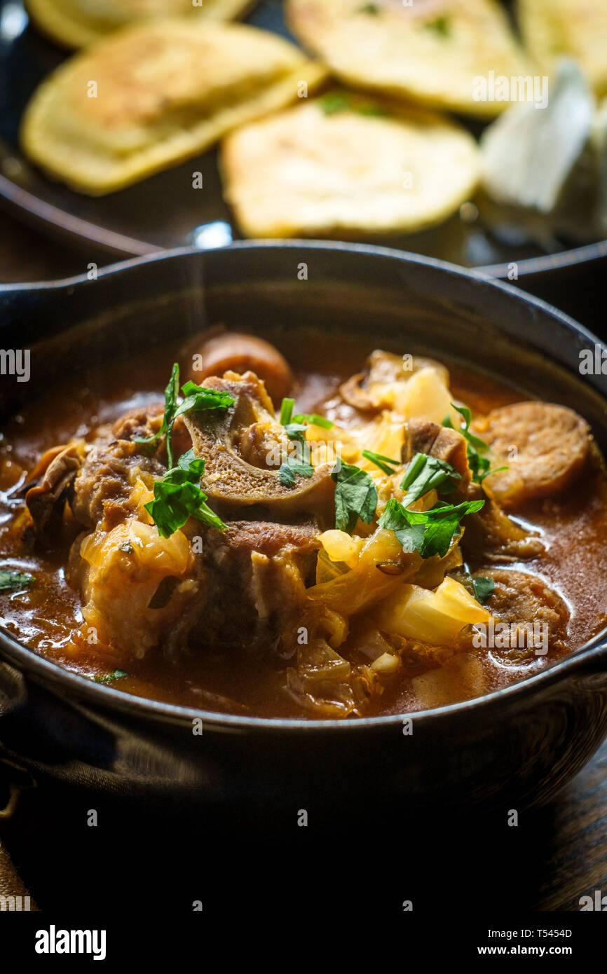 Polish hunters stew known as Bigos with pork loin sausage and lamb neck