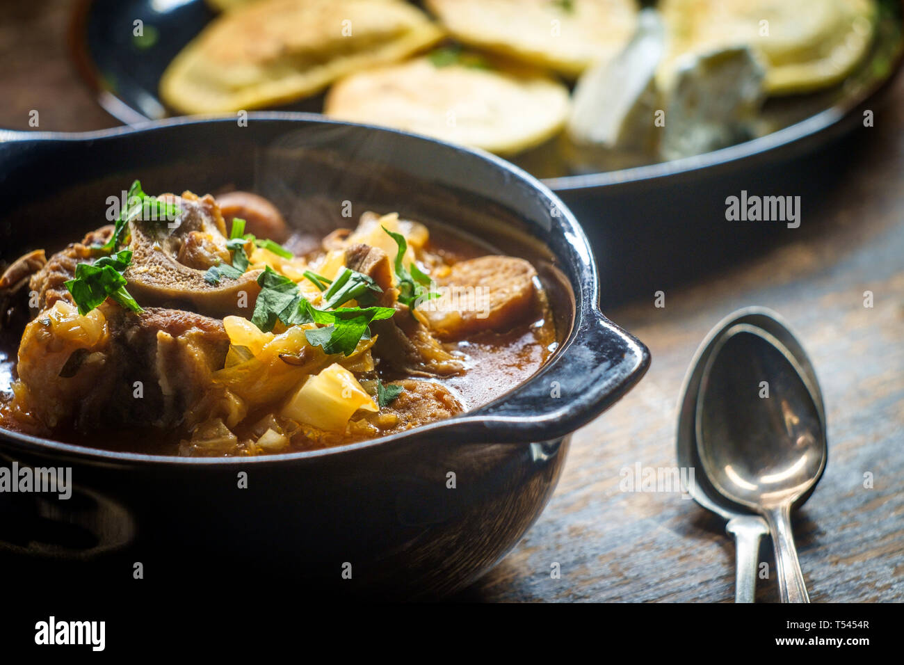 Polish hunters stew known as Bigos with pork loin sausage and lamb neck