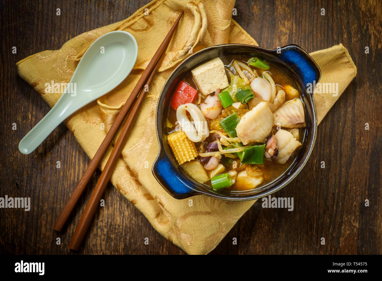 Korean seafood stew also called Haemul Jeongol with tofu tilapia octopus and calamari Stock Photo