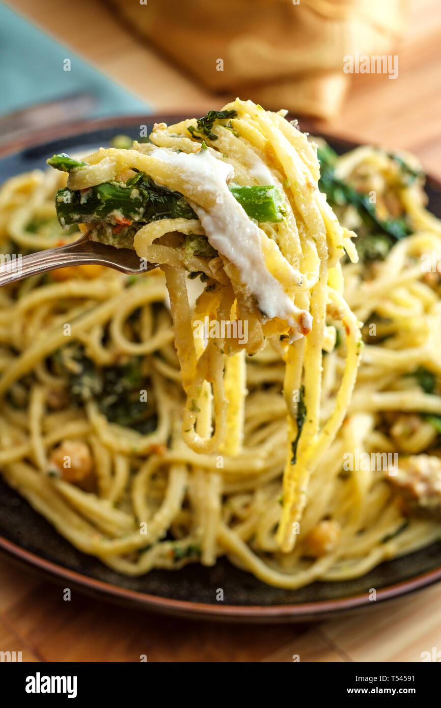 Linguine pasta with Italian sausage chickpeas and broccolini in a