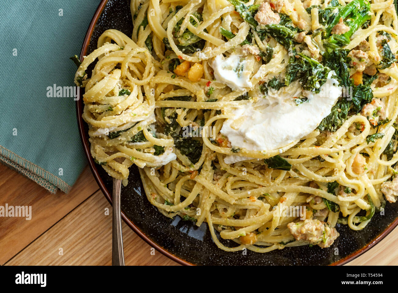 Linguine pasta with Italian sausage chickpeas and broccolini in a