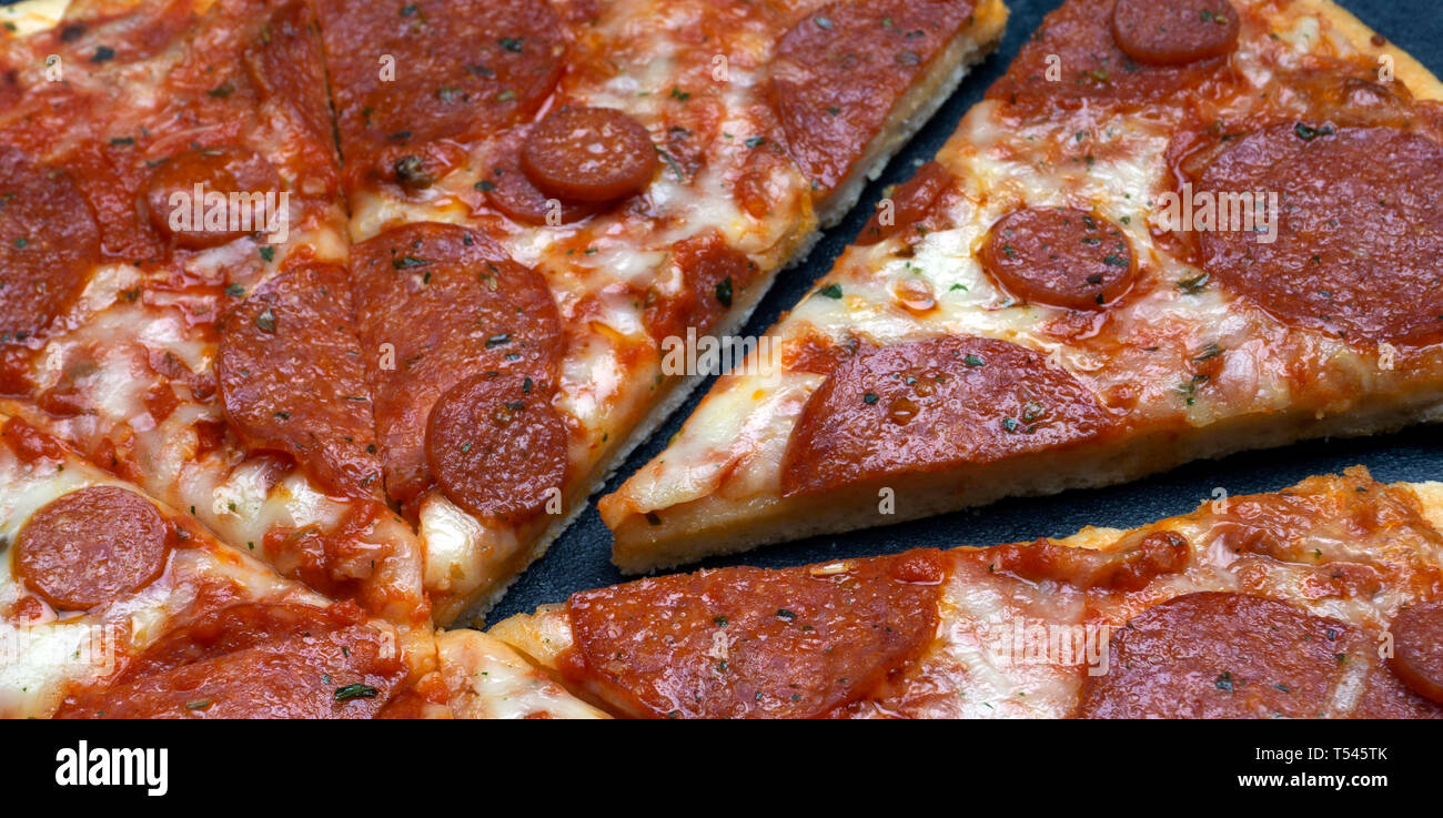 Italian pizza pepperoni on gray stone background Stock Photo - Alamy