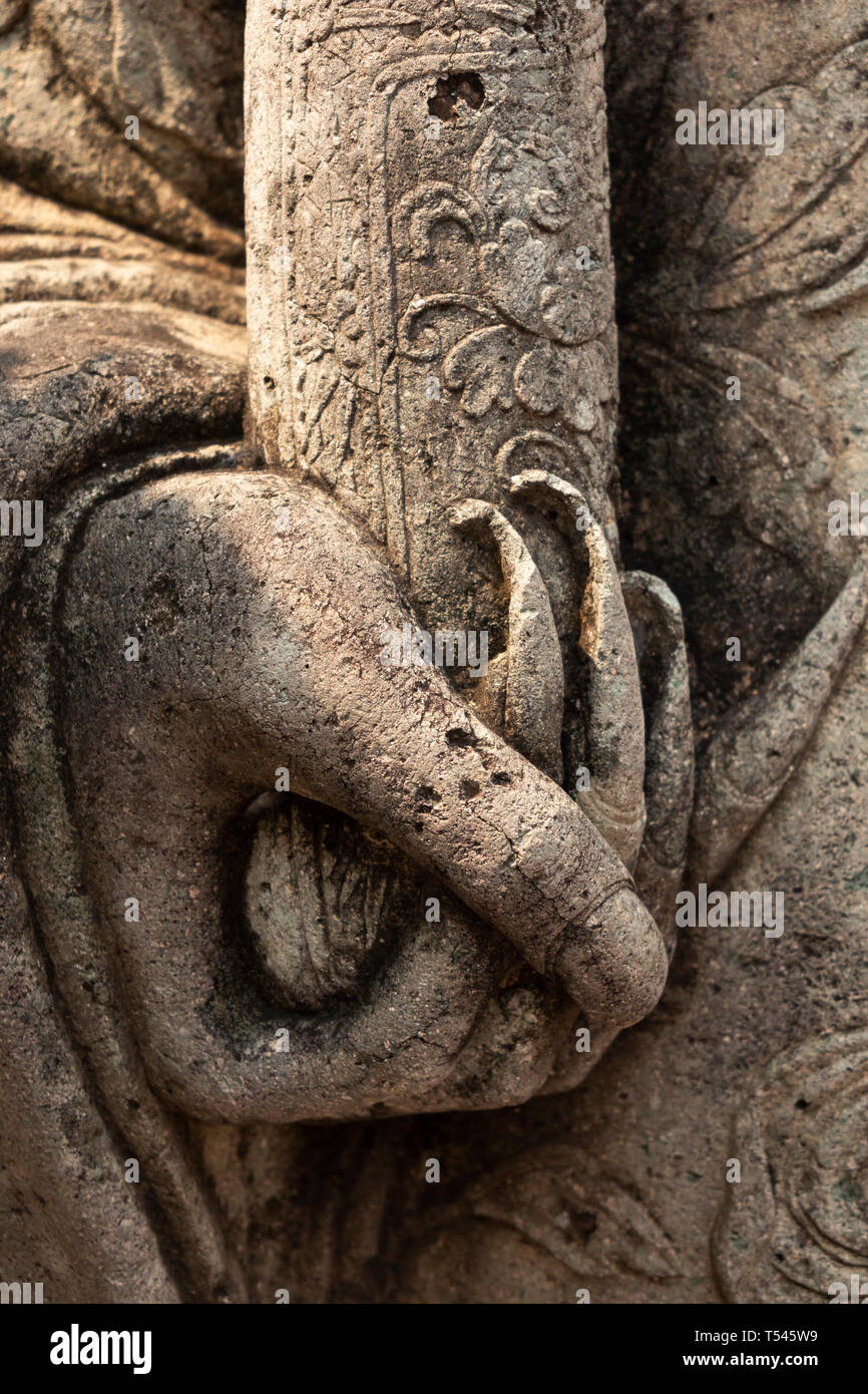 Thailand, Bangkok, Wat Pho, Phra Chedi Rai, sculpted figure detail of hand with very long fingernails holding scroll Stock Photo