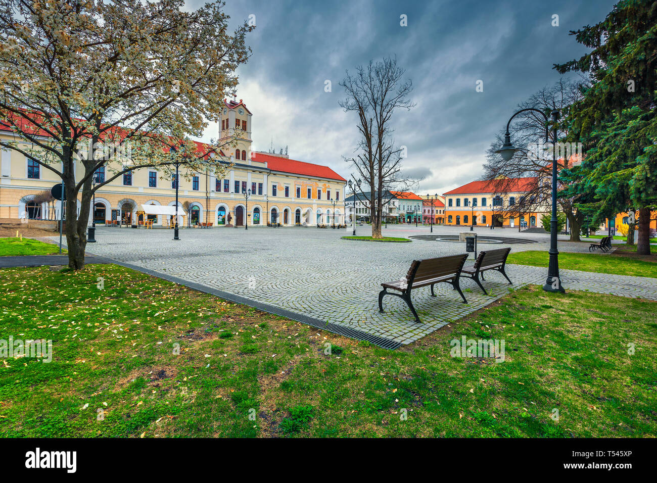 Fantastic Transylvanian touristic city and travel destination. Paved city center with fountain and flowery park, Sepsiszentgyorgy (Sfantu Gheorghe), T Stock Photo