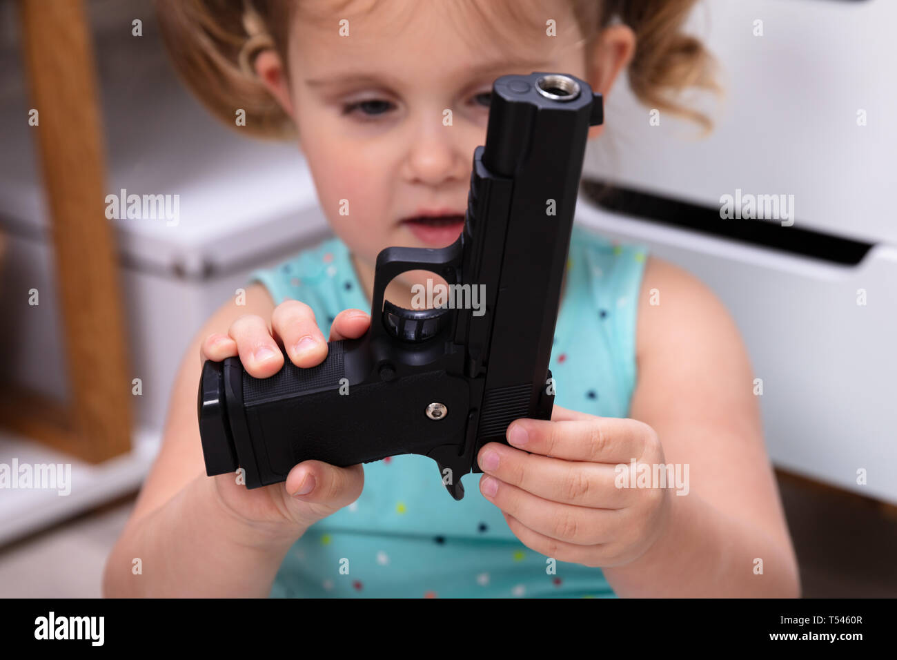 Black kid gun hires stock photography and images Alamy