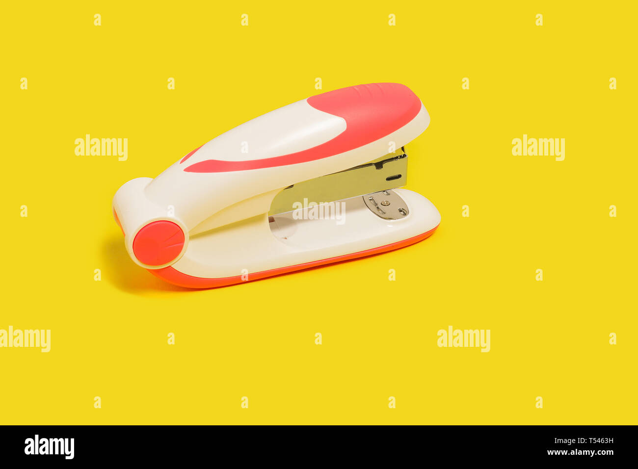 stapler on a yellow background Stock Photo