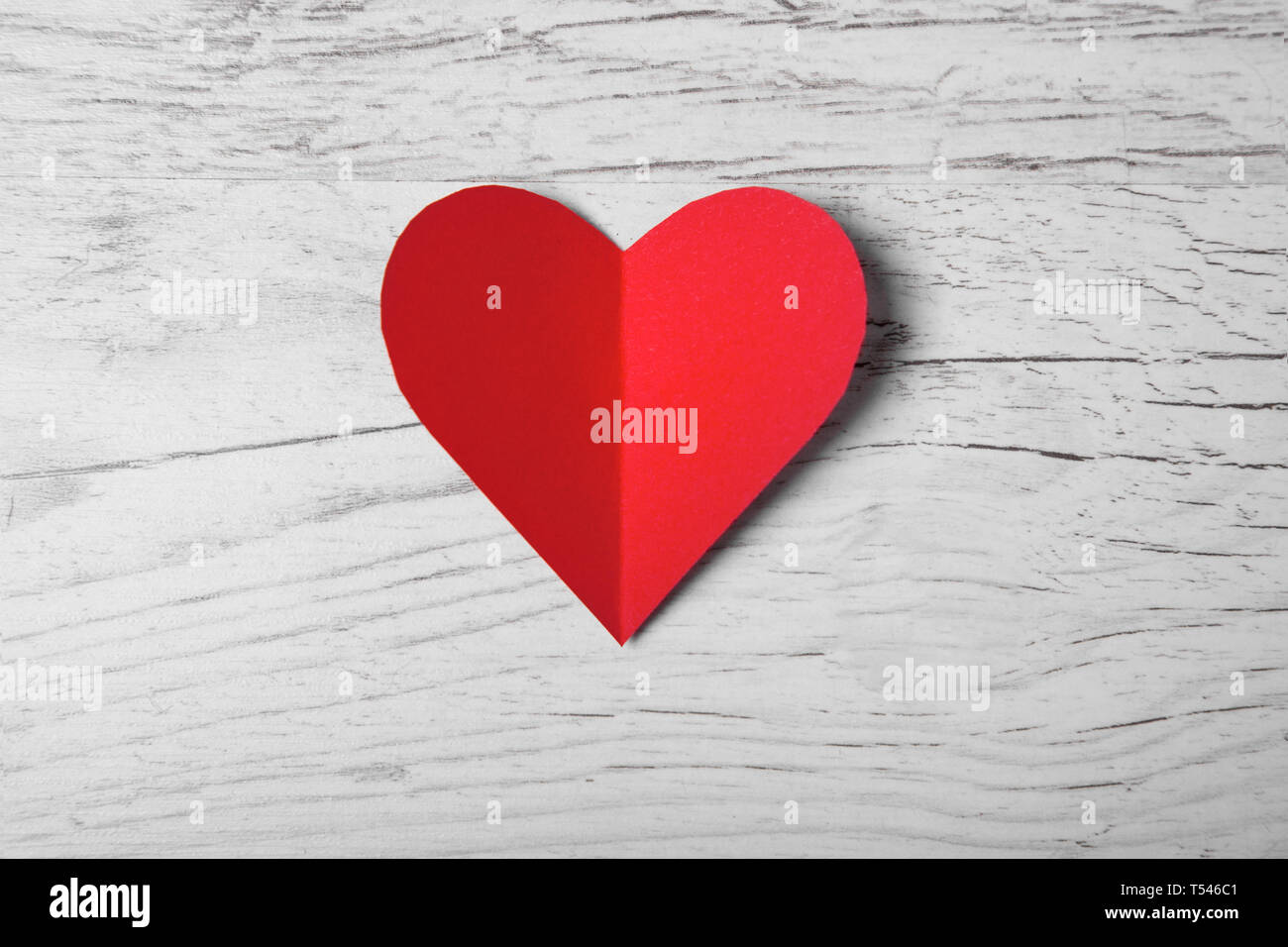 Happy Valentines day, Red Heart from paper on wood tabel. Good Holiday ...