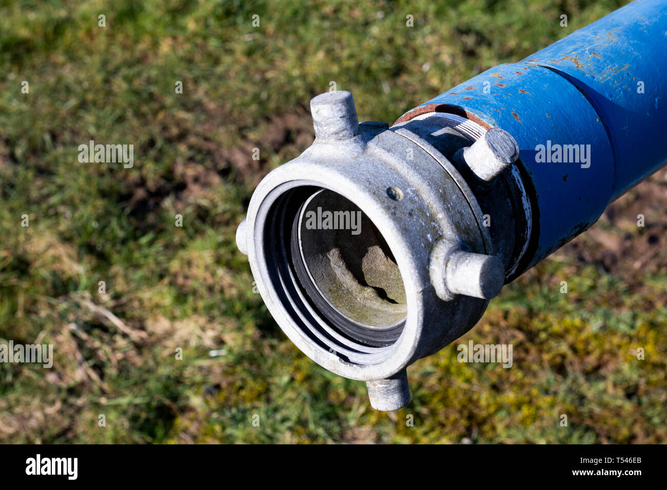 Six inch diameter pipe connection for hose to drain water tank Stock Photo