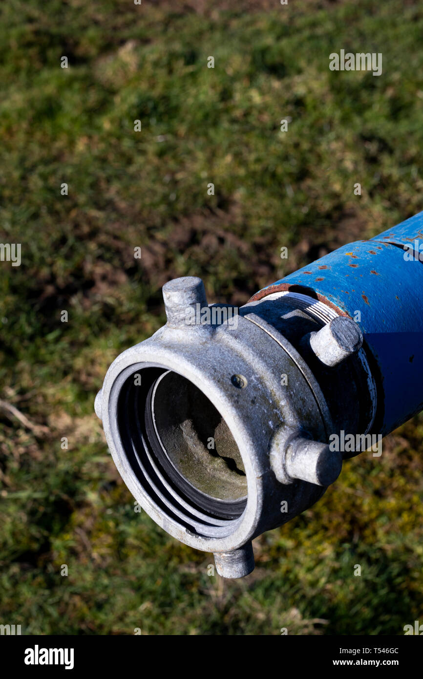 Six inch diameter pipe connection for hose to drain water tank Stock Photo