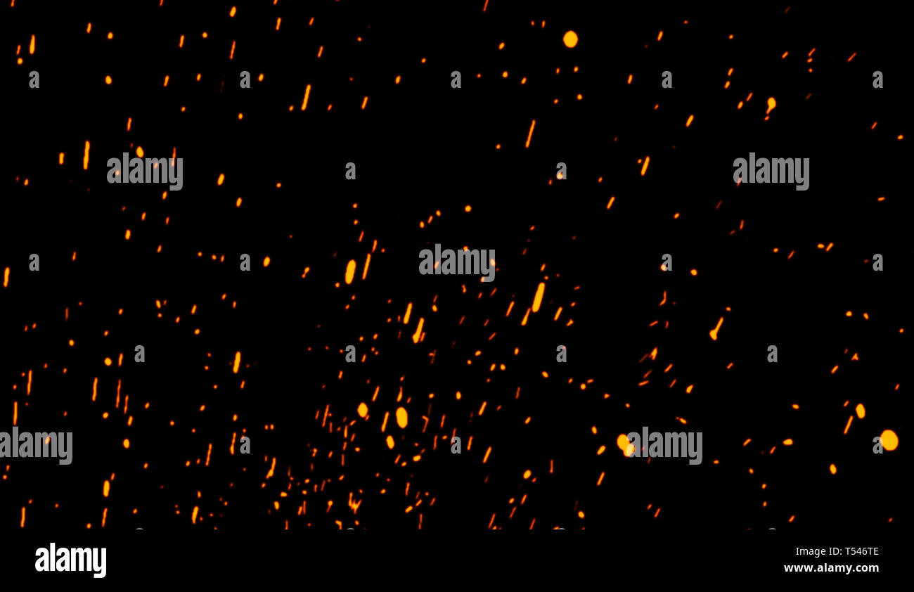 Fire particles effect dust debris isolated on black background, motion ...