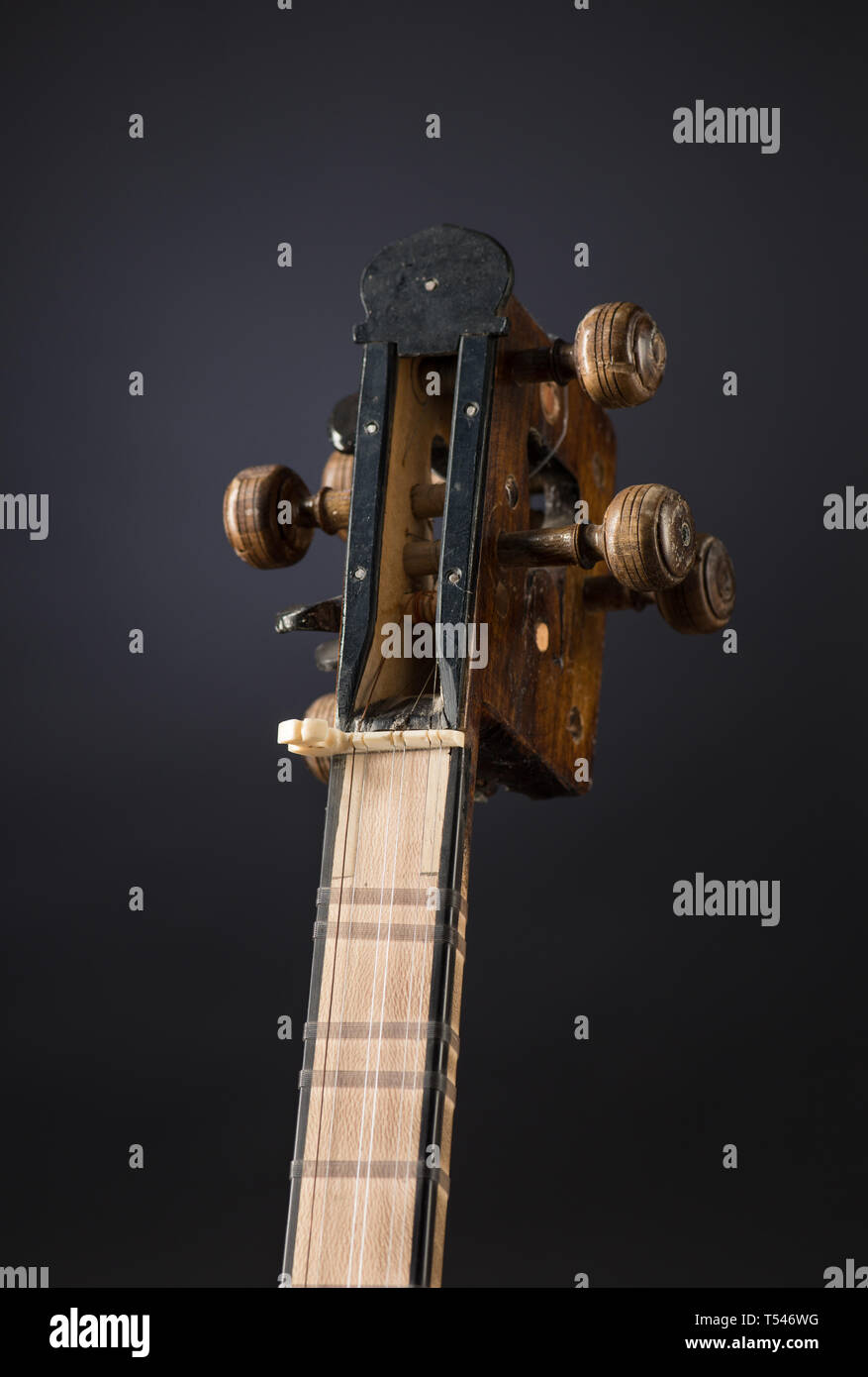 ancient Asian stringed musical instrument on black background with ...