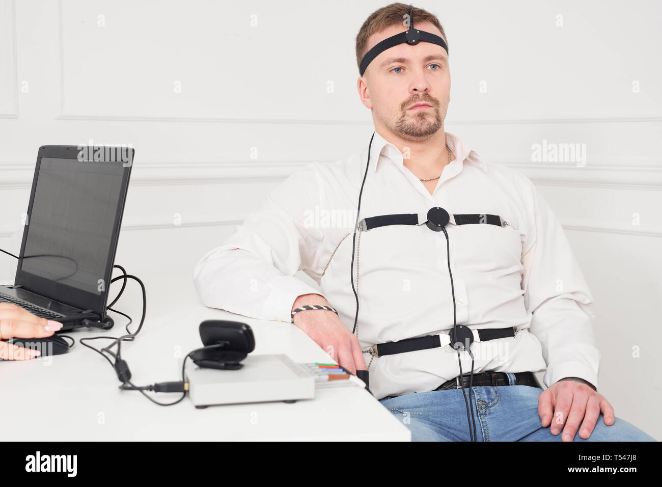 Man connected to the lie detector circuit. Stock Photo